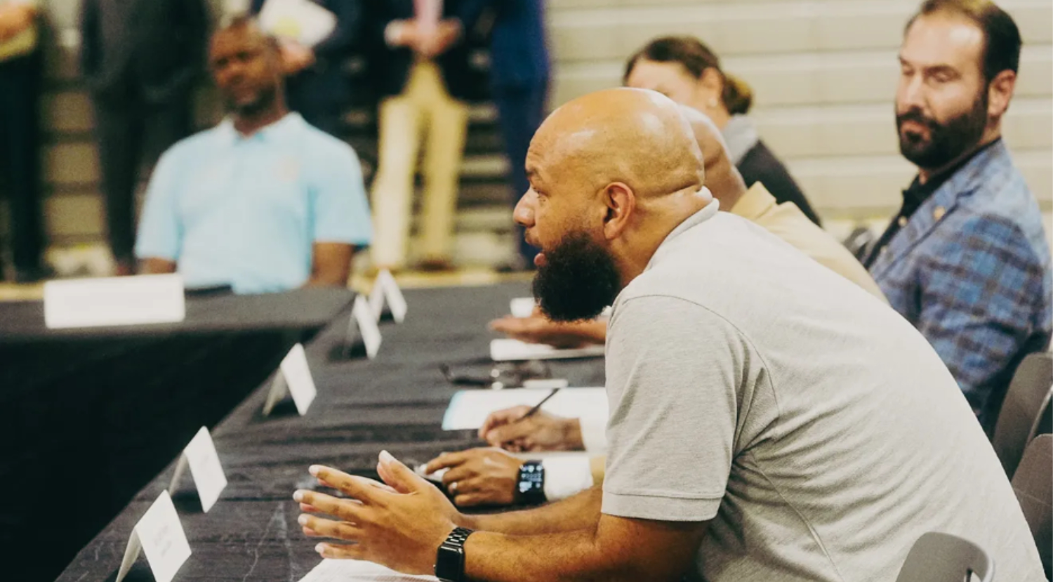 Memphis Allies Director of Operations Carl Davis Jr. speaks during a roundtable focused on fighting juvenile crime through afterschool programs with local and state officials, advocates, the YMCA, and Boys and Girls Club representatives on Aug. 11, 2025, at PURE Academy in Memphis, Tenn. Stu Boyd II-The Commercial Appeal